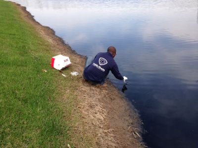 SW-0009
Photo Date: April 21, 2014
Photo Credit: Eric Kaufman
Description: EHS Fikru Hailu collects surface water samples at a pond with 0 % dissolved oxygen due to a release of organic materials from a nearby factory.
