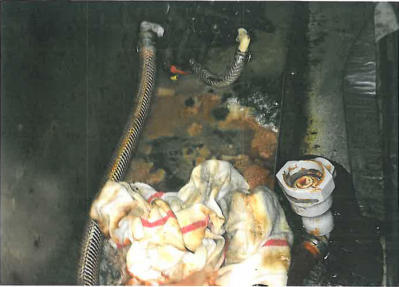 FS-0022
Photo Date: 02-17-16
Photo Credit: W.V. Tuley
Description: This is a photo of a cabinet below customer drink area, which contains the bags of ketchup for self-service, which show mold and filth. This was one of twenty violations. Upon reinspection on 02-29-16, all violations were corrected and a cleaning schedule was written.
