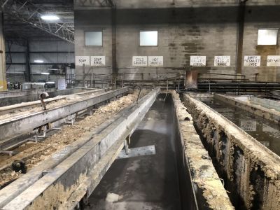 AQ-0008A
Photo Date: 08/27/2019
Photo Credit: Kyle Fender

**2019 Photo Content Winner for TAHP Category**

A wench lowering an aluminum bench broke at a metals plant. The bench fell into an ~8000 gallon open vat of sodium hydroxide solution, and the bench became fully submerged and the aluminum reacted with the sodium hydroxide solution producing Hydrogen (H2) gas which ignited.  Once the product level in the tank was lowered, and then the tank was refilled with water to dilute the solution, the flames ceased
