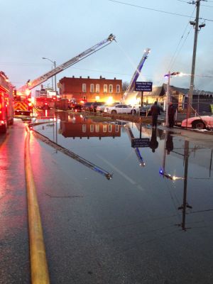 ER-0030
Photo Date: 1/21/2018
Photo Credit: Megan Rowe
A fire at an auto repair shop resulted in a large amount of fire suppression water. The large volume of water overwhelmed the storm system and led to first responder safety issues. 
