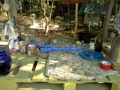 FS-0042C
Photo Date:	6/2015
Photo Credit:	Jennifer Heller
Description:	This was a “kitchen” in the woods that a local entrepreneur was using to process produce for sale to a Bloomington grocery.  There are three photos in the series…
