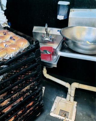 FS-0063
Photo Date: 7-11-2020
Photo Credit: Amy Ayers
Description: Hand sink in facility blocked by bread rack. Hand sink has sanitizer bucket (not in use) stored in hand sink. 
