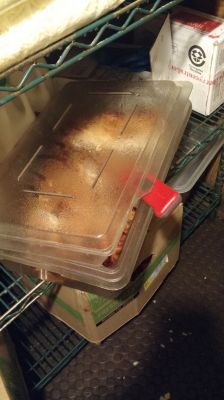FS-0012a
Photo Date: 11/10/2015
Photo Credit: JoAnn Xiong-Mercado
Description: Smoked turkey breasts cooling with a lid on, improper cooling.  Smoked turkey breasts measured in the temperature danger zone at 105 F.  Turkey was laid out on a sheet tray for rapid cool down within the allowable 2 hours to 70 F.
