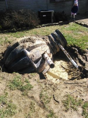 OWS-0024a
Photo Date:	March 2, 2018
Photo Credit:	Brad Rode
Description:	Dosing tank pushed out of ground by high water table


