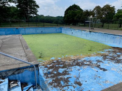 POOL-0036
Photo Date: 7/8/2019
Photo Credit: Devin Brennan
Description: Unused pool at a Country Club/Golf Course.
Pool was holding water and a mosquito harborage, several complaints from nearby residents. 
Happy ending to story: Pool was completely filled in (Sept 2019)

