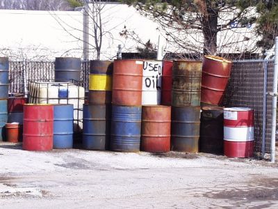 SHW-0008
Photo Date: 3/20/2002
Photo Credit: Jason Ravenscroft
Description: Unmarked and improperly stored 55-gallon drums of liquid waste.

