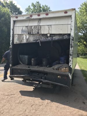 SHW-0022
Photo Date: 07/18/2019
Photo Credit: Kyle Fender
Description: A vehicle rear-ended a box truck and a chemical began to spill out of the rear of the box truck. The spill was determined to be from open buckets asphalt sealcoating material.
