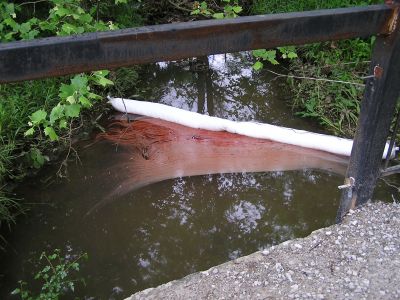 SW-0006
Photo Date: 6/4/2004
Photo Credit: Jason Ravenscroft
Description: Absorbent boom placed on a creek to catch fuel oil released to the waterway.

