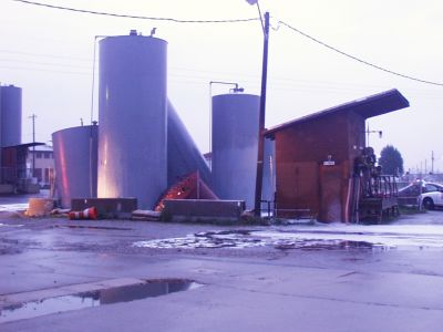 TANK-0002
Date: 7/22/2004
Photo Credit: Amber Heller
Description: Aftermath of a fire resulting from a lightening strike involving above ground storage tanks of flammable materials.

