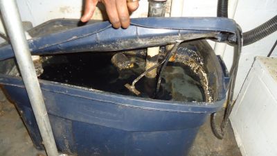 WW-0007b
Photo Date: March 26, 2018
Photo Credit: Anna Doerflein
Description: Plastic tote used to collect sink and laundry water and pump to sewer.  


