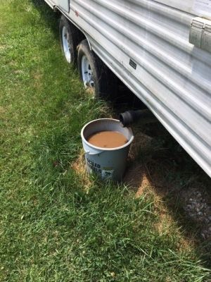 WW-0013
Photo Date: 7/9/2019
Photo Credit: Traci Bauman
Description:Complaint investigation re: camper in back yard of a rental property disposing of sewage via bucket. 
